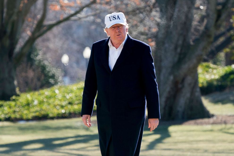 PHOTO: President Donald Trump walks across the South Lawn as he arrives at the White House in Washington, Jan. 7, 2018, after traveling from Camp David, Md.
