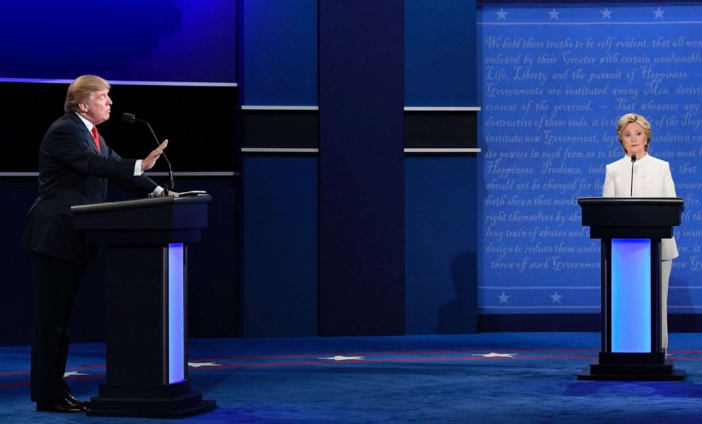 PHOTO: Republican nominee Donald Trump gestures as Democratic nominee Hillary Clinton looks on during the final presidential debate at the Thomas & Mack Center on the campus of the University of Las Vegas, Oct. 19, 2016.