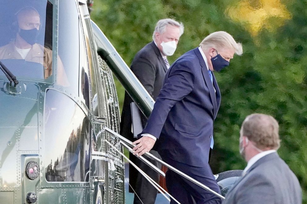 PHOTO:  President Donald Trump steps down from Marine One as he arrives at Walter Reed National Military Medical Center in Bethesda, Md.,Oct. 2, 2020.