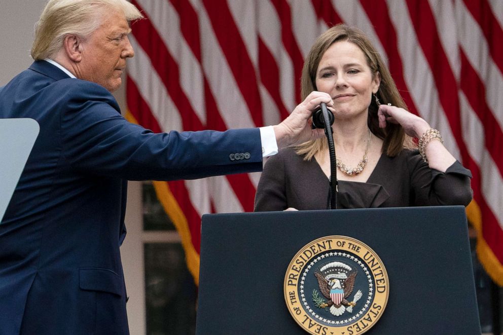PHOTO: President Donald Trump adjusts the microphone after he announced Judge Amy Coney Barrett as his nominee to the Supreme Court, in the Rose Garden at the White House, Sept. 26, 2020.