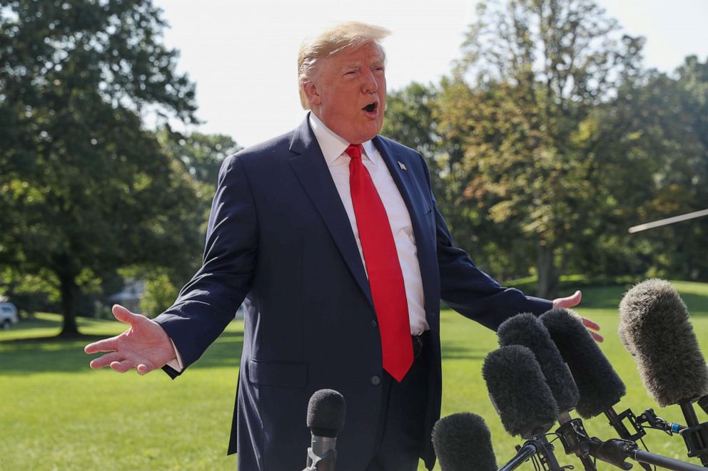 PHOTO: President Donald Trump talks to reporters as he departs for travel to New York and New Jersey from the South Lawn of the White House in Washington, Aug. 9, 2019.