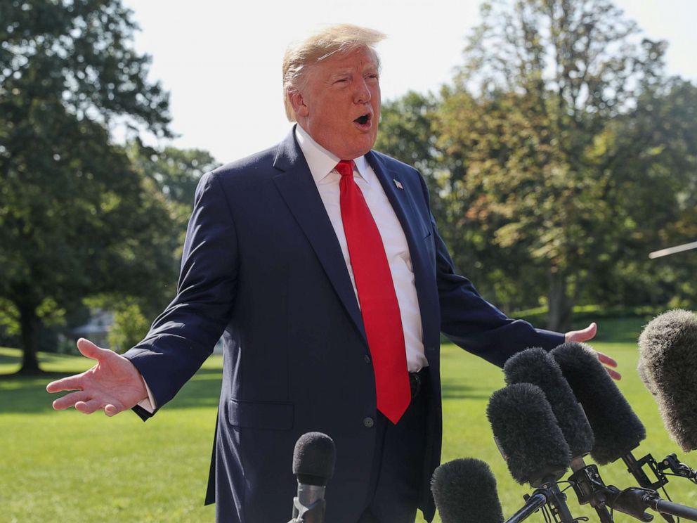 PHOTO: President Donald Trump talks to reporters as he departs for travel to New York and New Jersey from the South Lawn of the White House in Washington, Aug. 9, 2019.