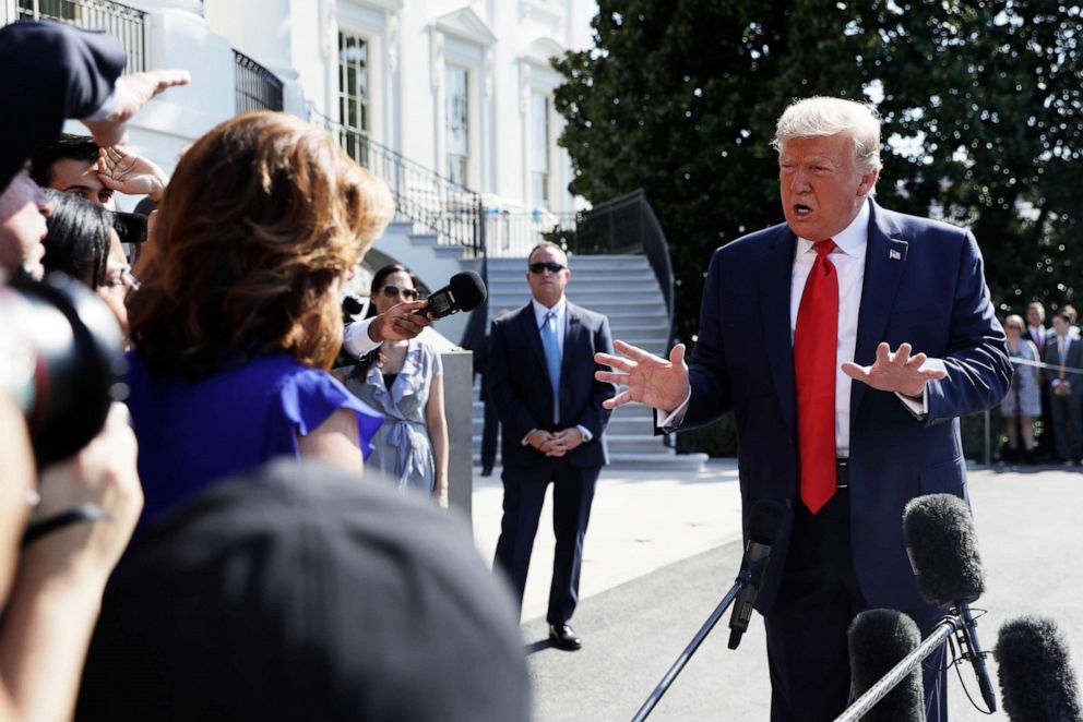 PHOTO: President Donald Trump talks to reporters on the South Lawn of the White House, Friday, Aug. 9, 2019, in Washington.