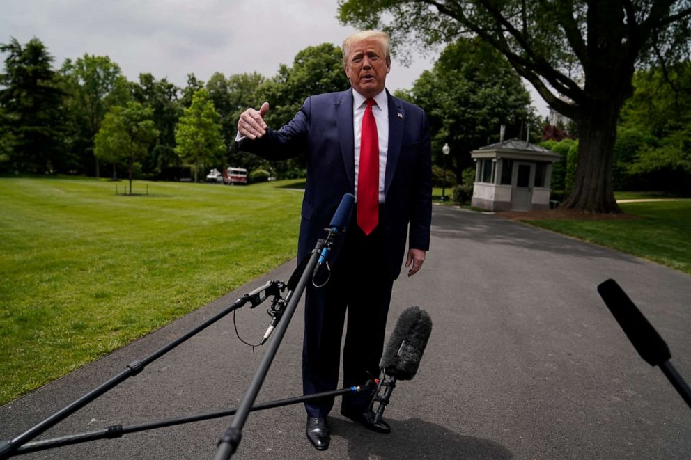 PHOTO: President Donald Trump talks to reporters before departing the White House for a trip to Michigan, May 21, 2020, in Washington.