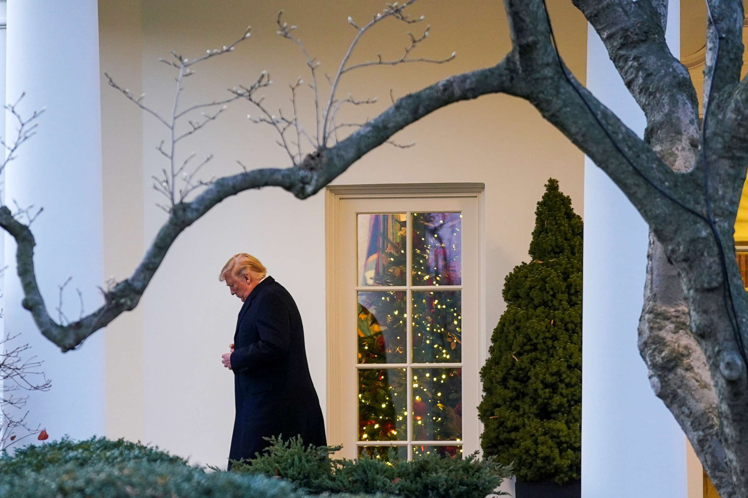 PHOTO: President Donald Trump exits the Oval Office as he departs for Michigan from the White House in Washington, Dec. 18, 2019.
