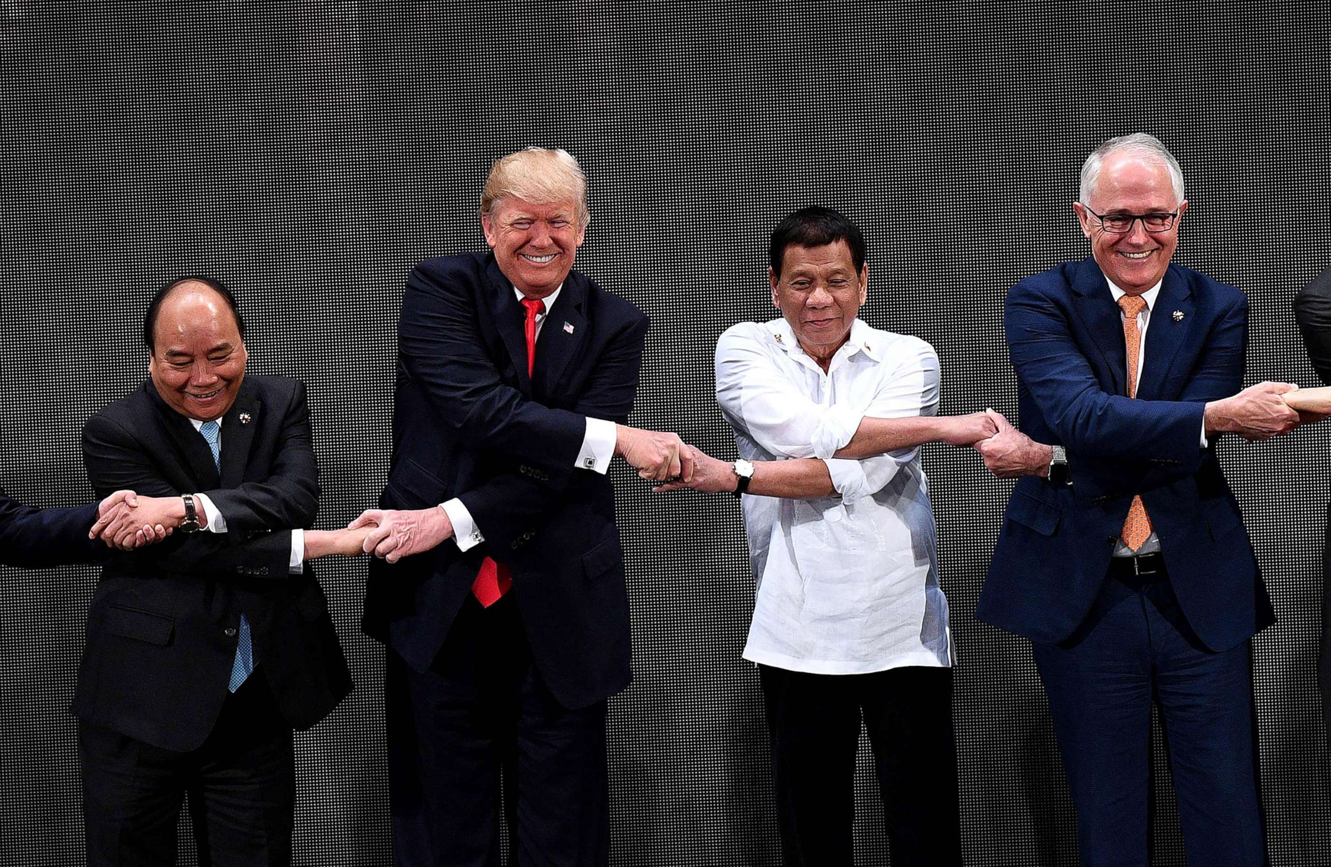 PHOTO: Vietnam's Prime Minister Nguyen Xuan Phuc, President Donald Trump, Philippine President Rodrigo Duterte, Australia Prime Minister Malcolm Turnbull, link hands during the the 31st ASEAN Summit in Manila Philippines, Nov. 13, 2017.