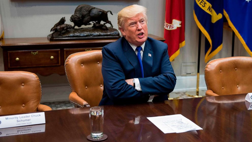 President Donald Trump speaks next to the empty chairs of Chuck Schumer and Nancy Pelosi after the Democratic leaders cancelled their meeting at the White House in Washington, Nov. 28, 2017.