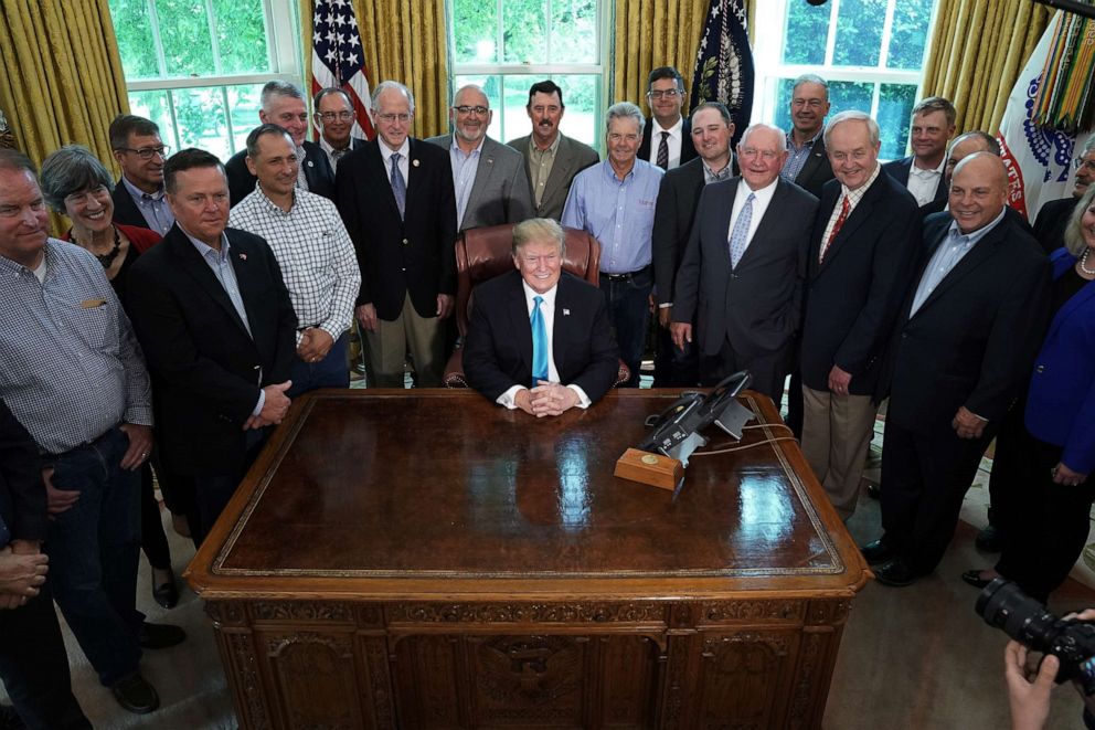 PHOTO: President Donald Trump poses for photographs with Rep. Mike Conaway of Texas and farmers and ranchers from across the country in the Oval Office at the White House, May 23, 2019.