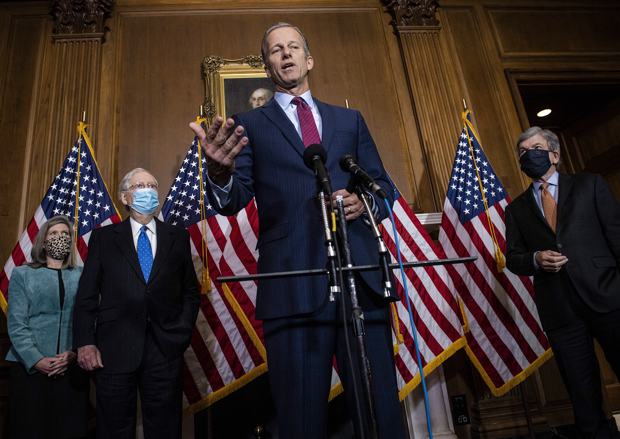 PHOTO:  Sen. John Thune talks to reporters following the weekly Republican Senate conference meeting at the Capitol flanked by Sen. Joni Ernst, Senate Majority Leader Mitch McConnell, and Sen. Roy Blunt in Washington, Dec. 1, 2020.