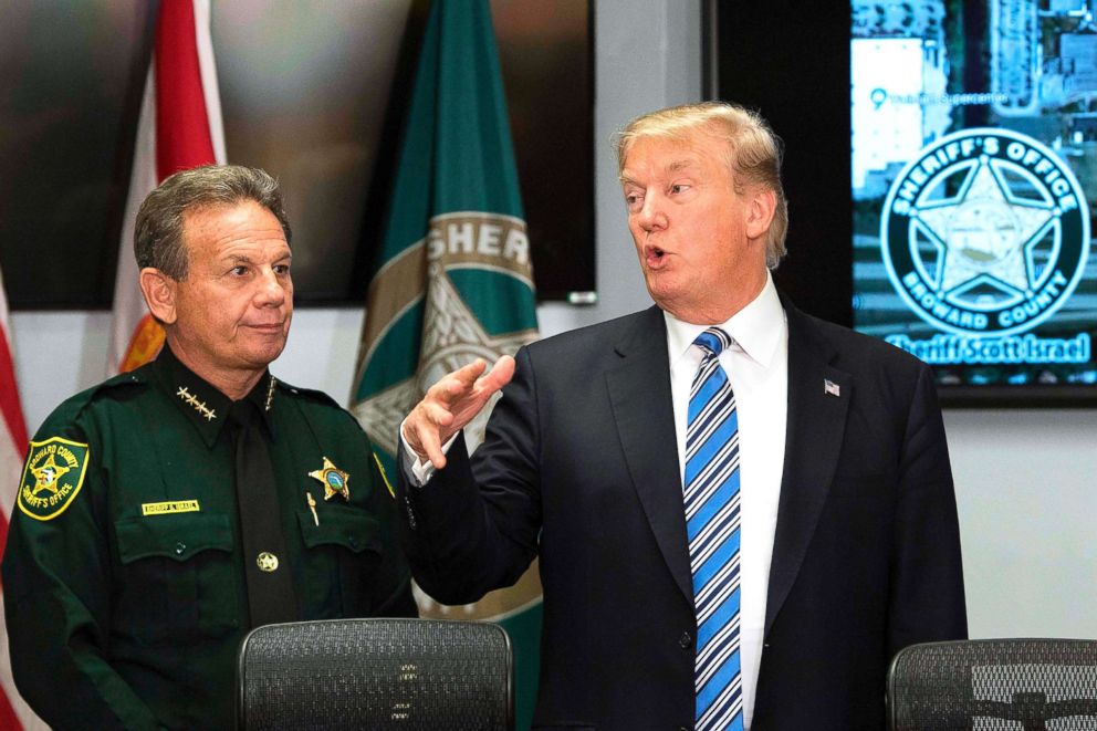 PHOTO: President Donald Trump speaks with Broward County Sheriff Scott Israel while visiting first responders at Broward County Sheriff's Office in Pompano Beach, Fla., on Feb. 16, 2018. 