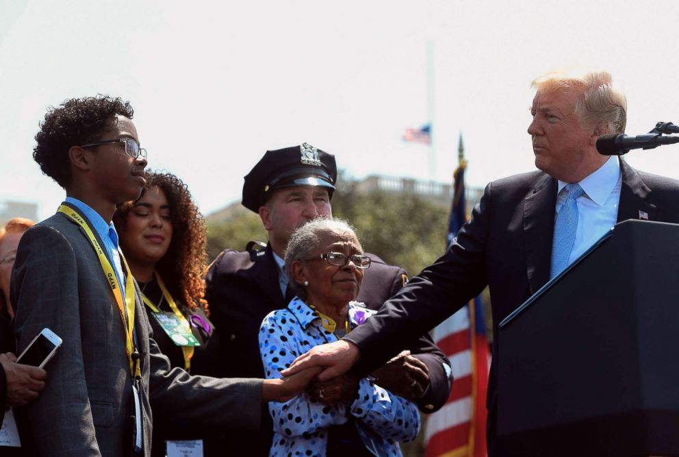 PHOTO: President Donald Trump stands with the family of a fallen police officer, Miosotis Familia, as he addresses the 37th Annual National Peace Officers Memorial Service at the U.S. Capitol in Washington on May 15, 2018.