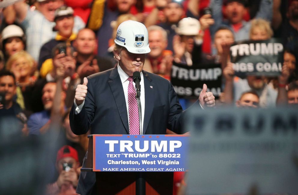 PHOTO: Republican Presidential candidate Donald Trump models a hard hat in support of the miners during his rally at the Charleston Civic Center on Charleston, W.Va., May 5, 2016.