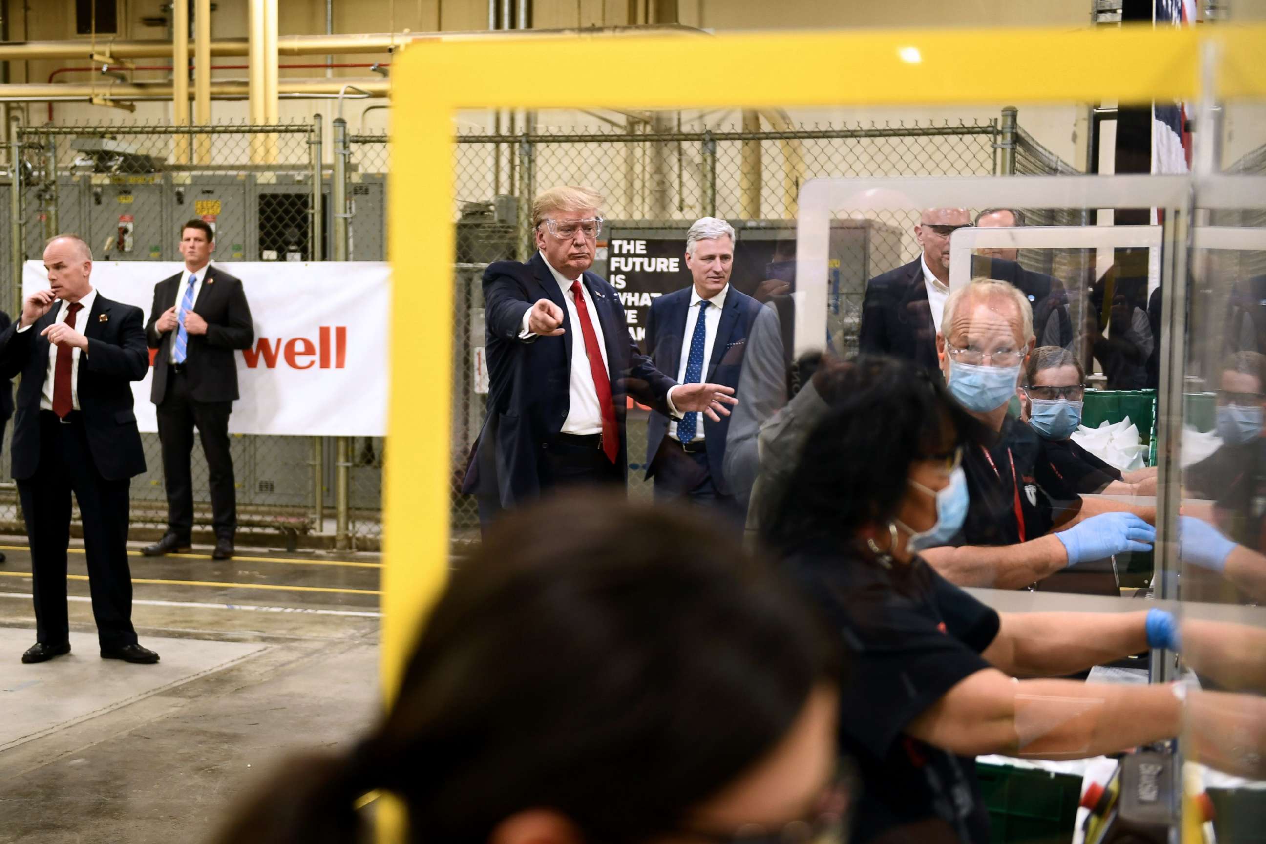 PHOTO: President Donald Trump participates in a tour of a Honeywell International plant that manufactures personal protective equipment in Phoenix, on May 5, 2020.