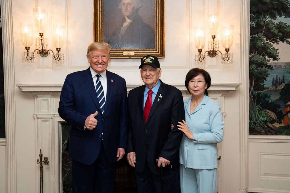 PHOTO: In an official handout photo from the White House, President Donald J. Trump meets World War II Iwo Jima veteran Ira Rigger, 97, and his wife Yong Rigger on Tuesday, March 3, 2020, in the Diplomatic Reception Room of the White House in Washington.
