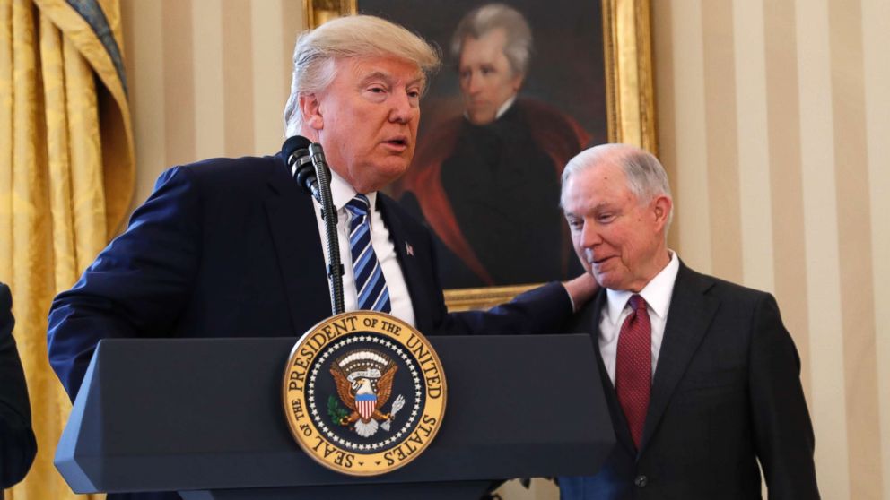 President Donald Trump talks to Attorney General Jeff Sessions in the Oval Office of the White House, Feb. 9, 2017, before Vice President Mike Pence administered the oath of office Sessions.