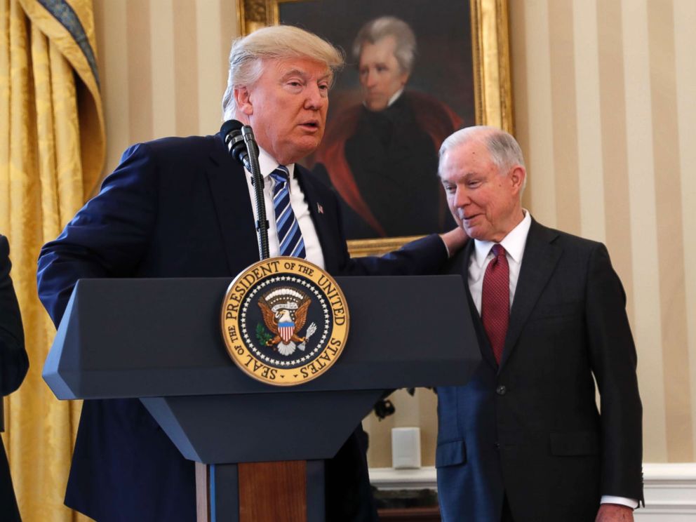 PHOTO: President Donald Trump talks to Attorney General Jeff Sessions in the Oval Office of the White House in Washington, Thursday, Feb. 9, 2017, before Vice President Mike Pence administered the oath of office Sessions.