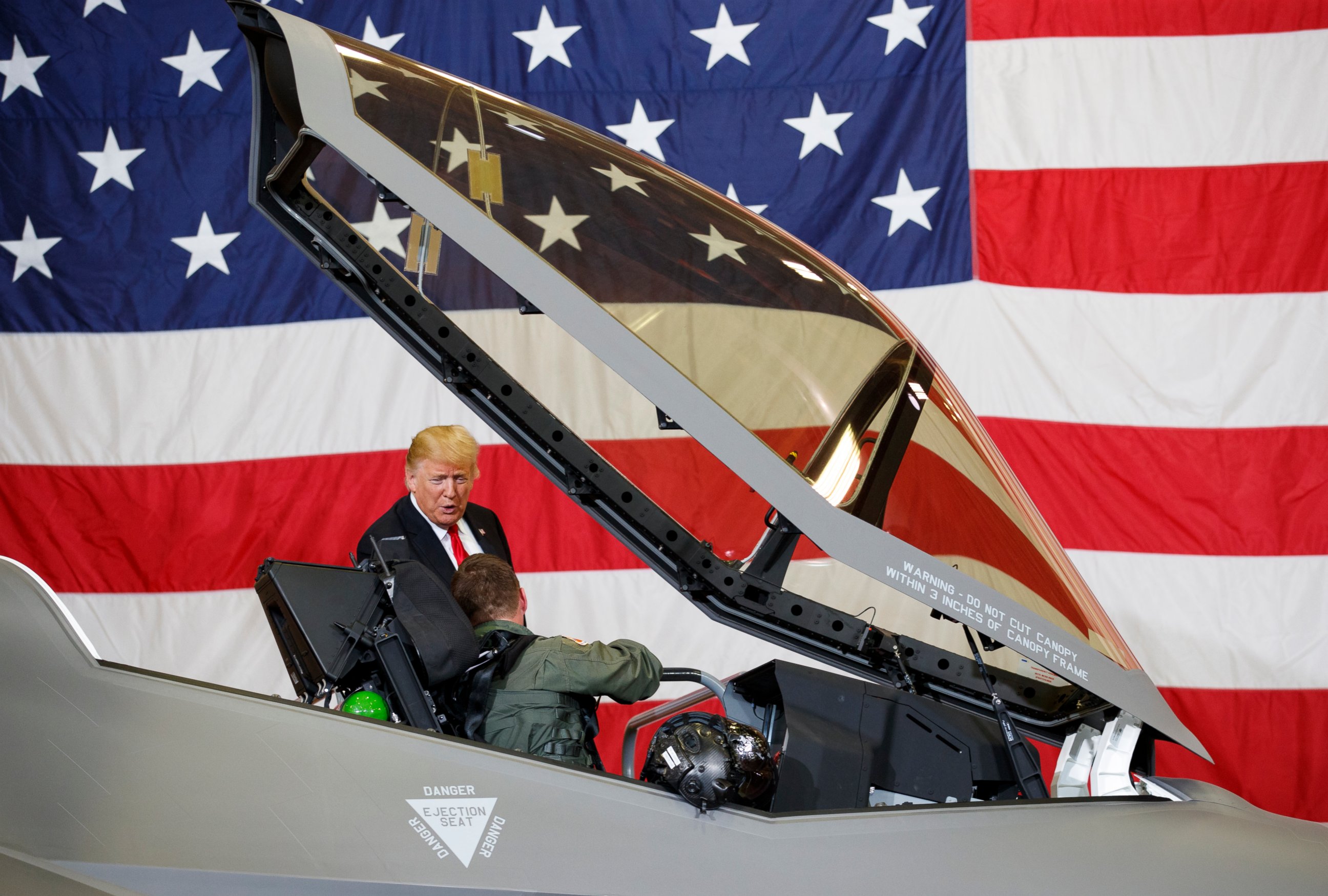 PHOTO: President Donald Trump talks to a pilot in the cockpit of an F-35 aircraft during a Defense Capability Tour at Luke Air Force Base, Ariz., Friday, Oct. 19, 2018. 