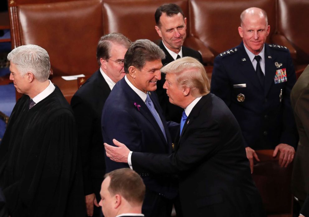 PHOTO: President Donald Trump hugs Democratic Senator from West Virginia Joe Manchin as he departs after delivering his State of the Union address to a joint session of the U.S. Congress on Capitol Hill in Washington, Jan. 30, 2018.