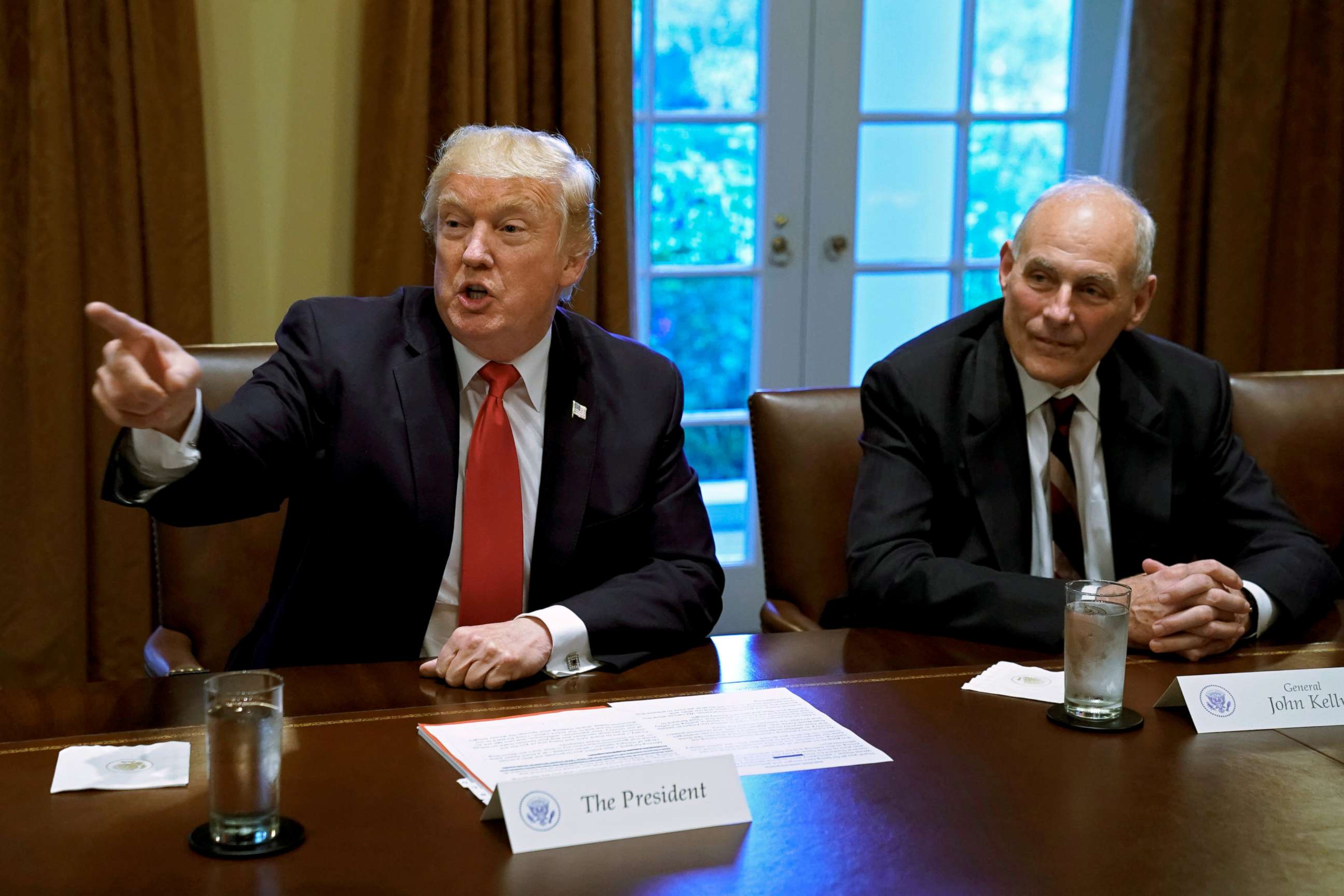PHOTO: President Donald Trump gestures next to White House Chief of Staff John Kelly during a briefing with senior military leaders at the White House in Washington, D.C., Oct. 5, 2017.