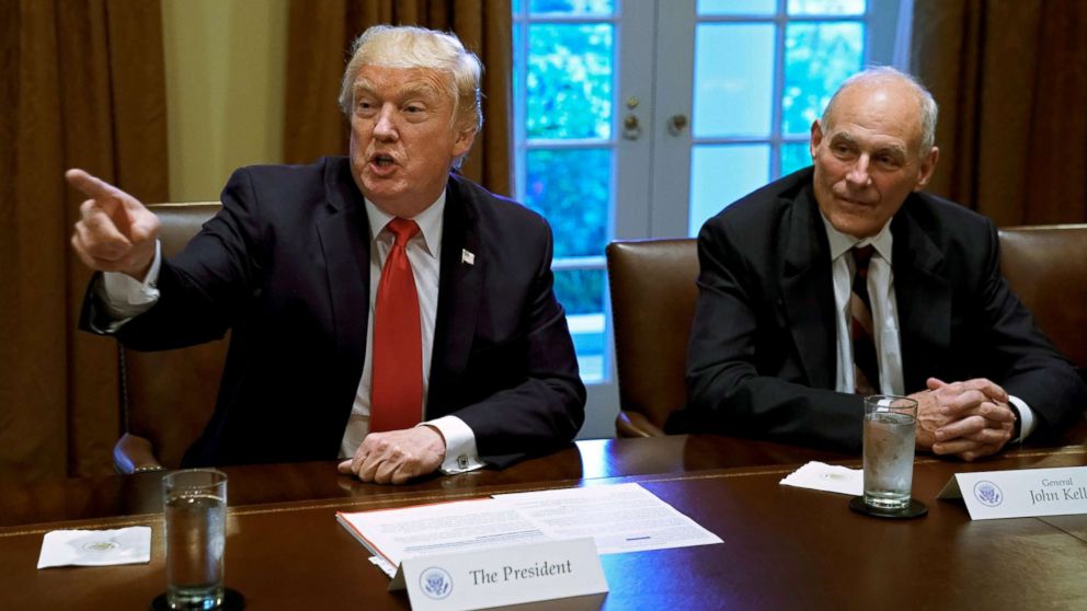 President Donald Trump gestures next to White House Chief of Staff John Kelly during a briefing with senior military leaders at the White House in Washington, D.C., Oct. 5, 2017.