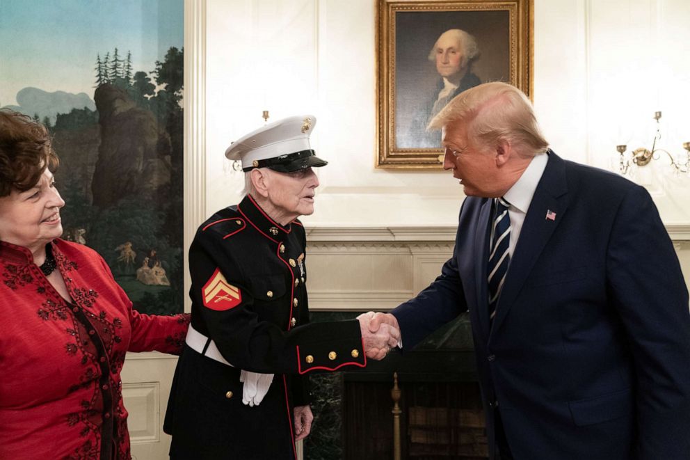 PHOTO: President Donald J. Trump meets World War II Iwo Jima veteran John J. Sheridan, 95, and his daughter Dianne Fairbaugh on Tuesday, March 3, 2020, in the Diplomatic Reception Room of the White House in Washington.