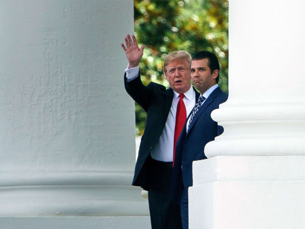 PHOTO: President Donald Trump (L) and his son Donald Trump, Jr., walk to a motorcade from the North Portico of the White House on July 5, 2018 in Washington, D.C.