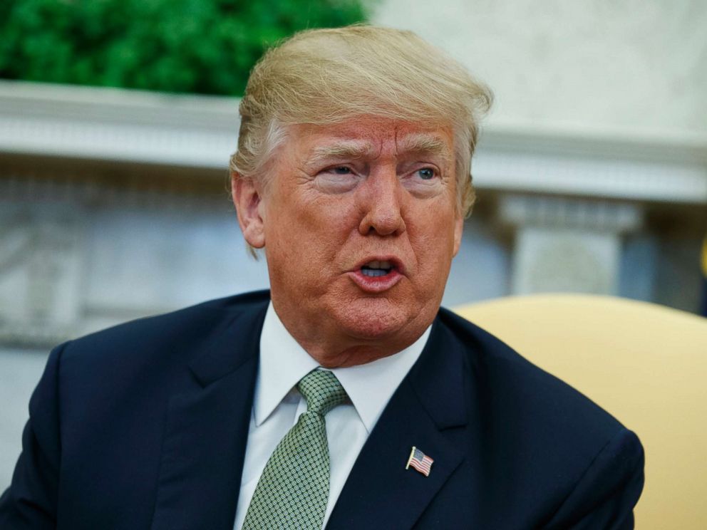 PHOTO: President Donald Trump talks with reporters during a meeting in the Oval Office of the White House in Washington, D.C., March 15, 2018.