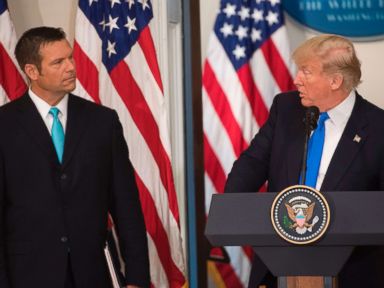 PHOTO: President Donald Trump speaks alongside Kansas Secretary of State Kris Kobach (L) during the first meeting of the Presidential Advisory Commission on Election Integrity in the Eisenhower Executive Office Building in Washington, D.C., July 19, 2017.