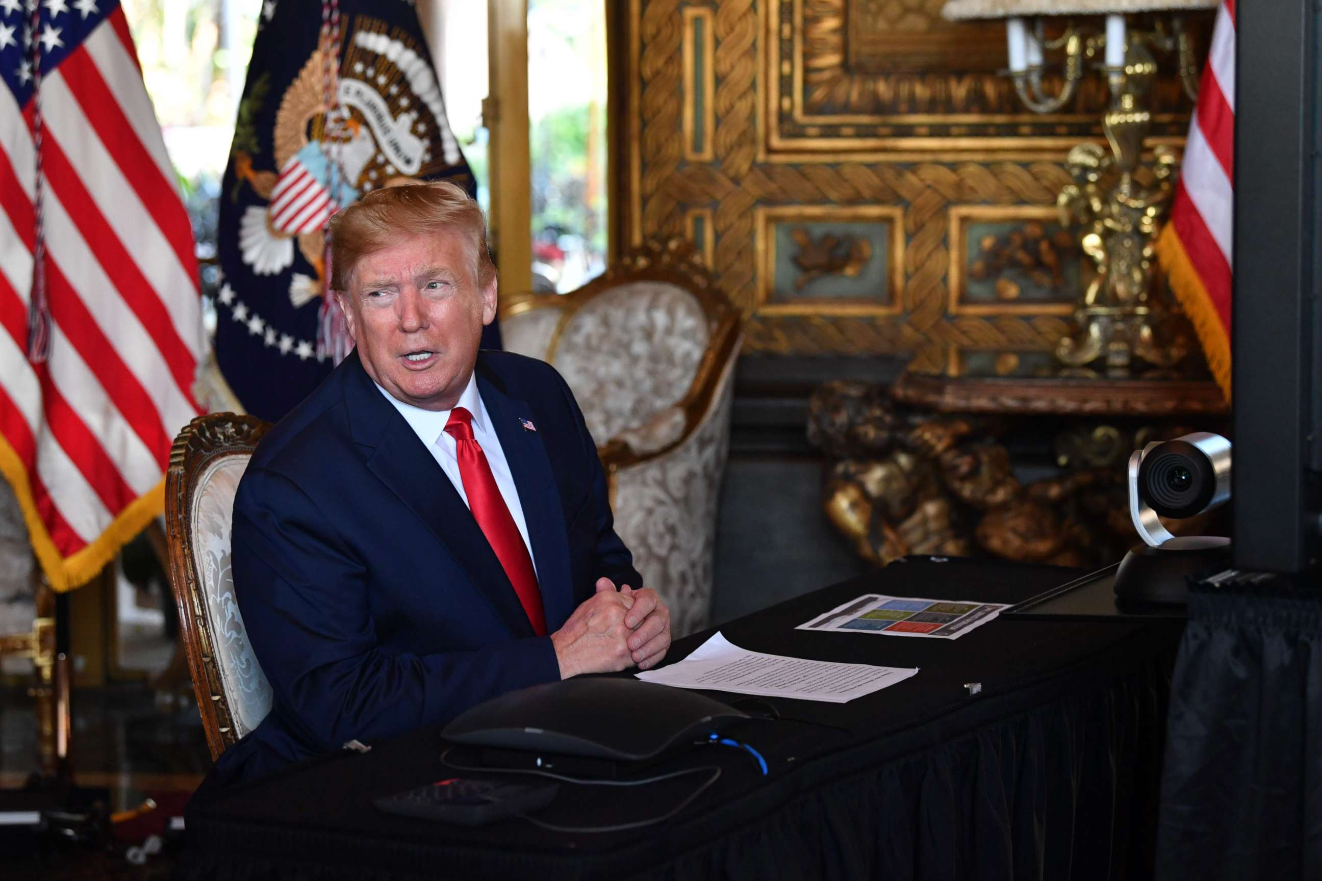 PHOTO: President Donald Trump answers questions from reporters after making a video call to the troops stationed worldwide at the Mar-a-Lago estate in West Palm Beach, Fla., Dec. 24, 2019.