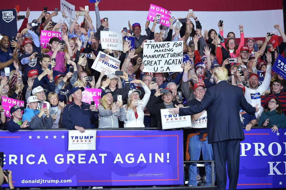 PHOTO: President Donald Trump walks on stage at a rally at Total Sports Park in Washington, Michigan, April 28, 2018.