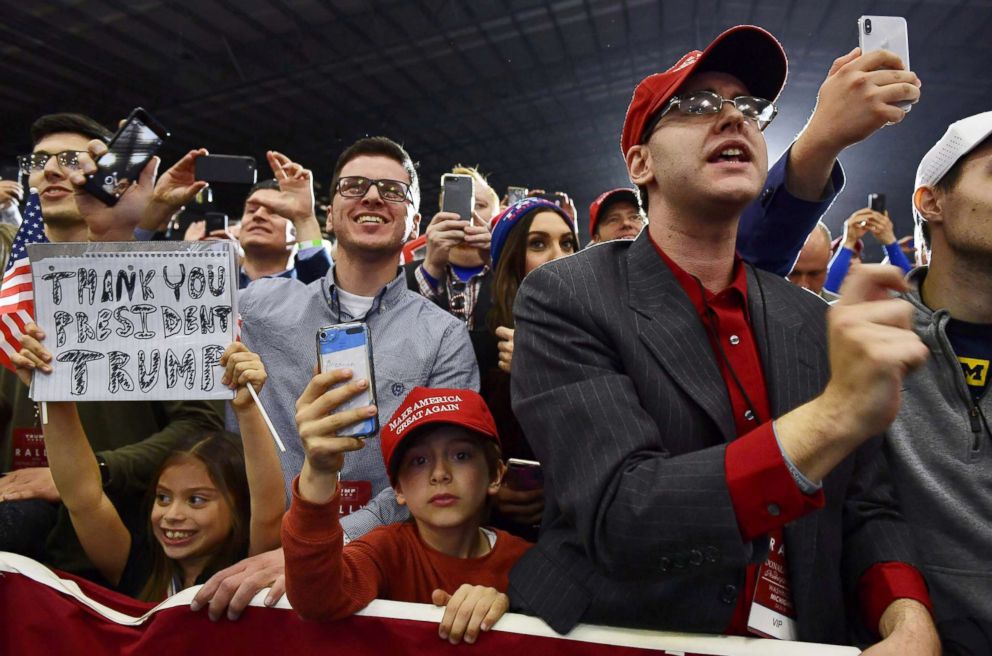 PHOTO: Supporters of President Donald Trump look on as he speaks during a rally at Total Sports Park in Washington, Michigan, April 28, 2018.