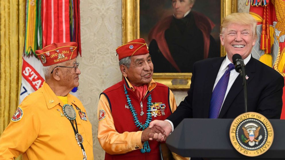 PHOTO: President Donald Trump, right, meets with Navajo Code Talkers Peter MacDonald, center, and Thomas Begay, left, in the Oval Office of the White House in Washington, Nov. 27, 2017.