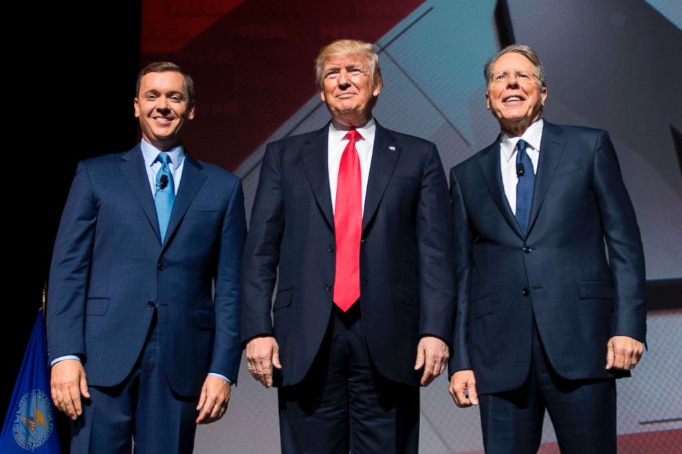 PHOTO: President Donald Trump stands with National Rifle Association (NRA) President Wayne LaPierre (R) and NRA-ILA Executive Director Chris Cox (L) during the NRA Leadership Forum in Atlanta, April 28, 2017.
