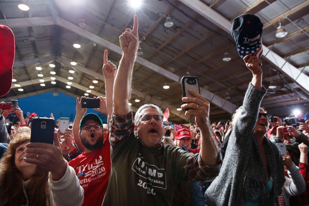 PHOTO: Supporters of President Donald Trump cheer as he arrives for a campaign rally, Friday, Oct. 12, 2018, in Lebanon, Ohio.