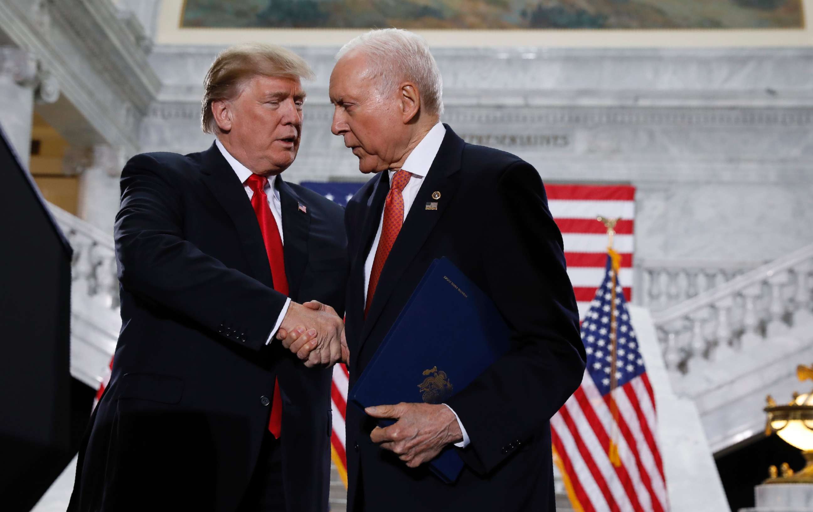 PHOTO: President Donald Trump is greeted by Sen. Orrin Hatch prior to speaking at the Utah State Capitol in Salt Lake City, Dec. 4, 2017.