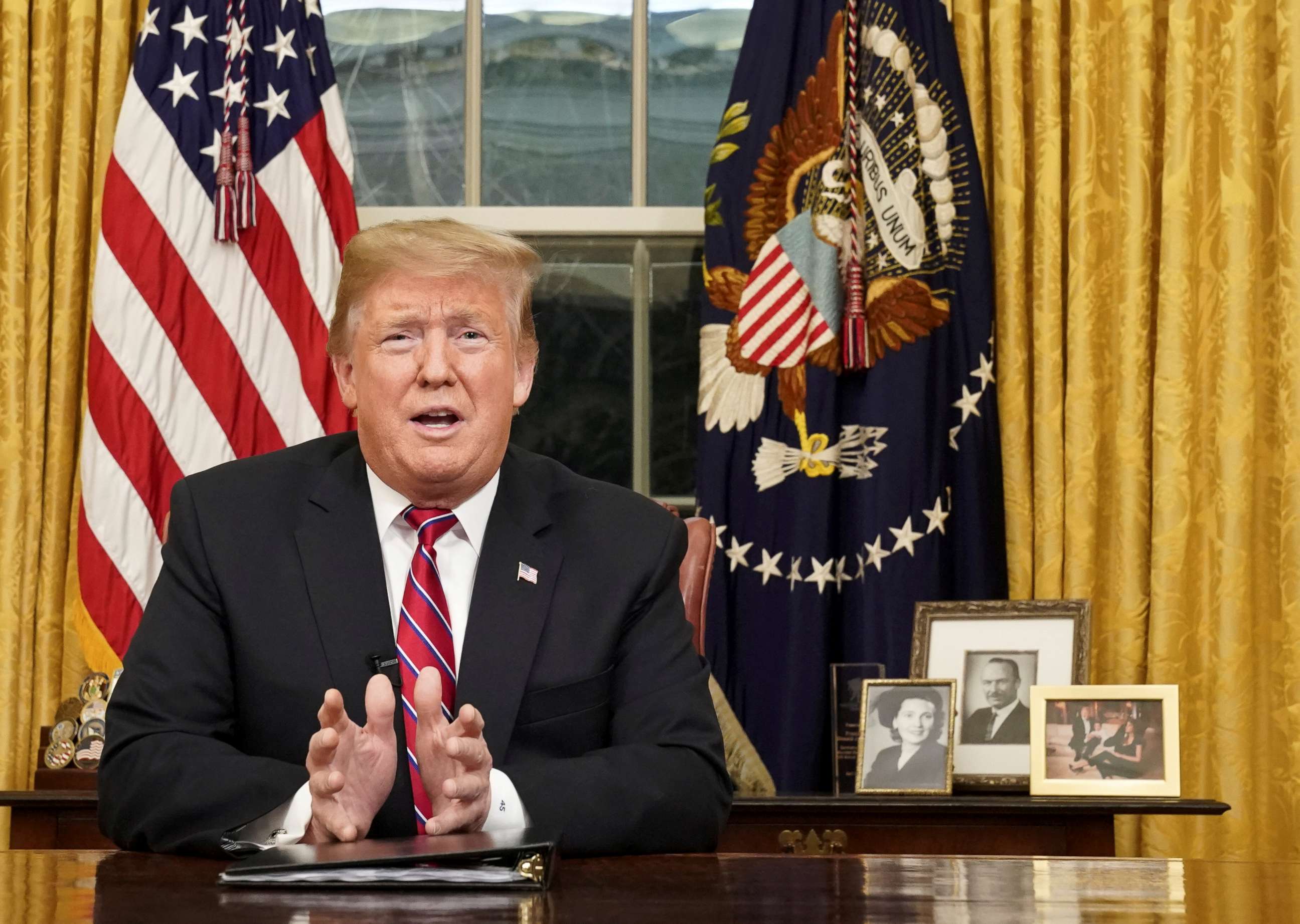 PHOTO: President Donald Trump delivers a televised address to the nation from his desk in the Oval Office at the White House in Washington, Jan. 8, 2019.