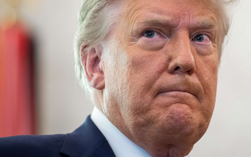 PHOTO: President Donald Trump looks on during a ceremony in the Oval Office of the White House in Washington, Dec. 7, 2020.