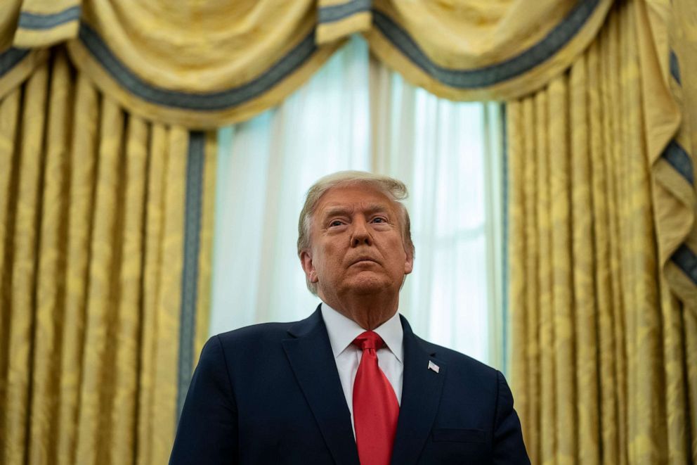 PHOTO: President Donald Trump listens during a ceremony in the Oval Office of the White House, Dec. 3, 2020, in Washington.