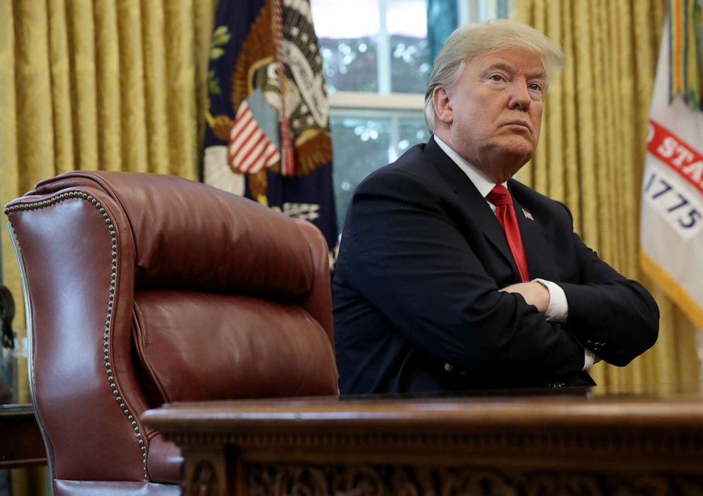 PHOTO: President Donald Trump talks to the press in the Oval Office of the White House, Oct. 10, 2018 in Washington.