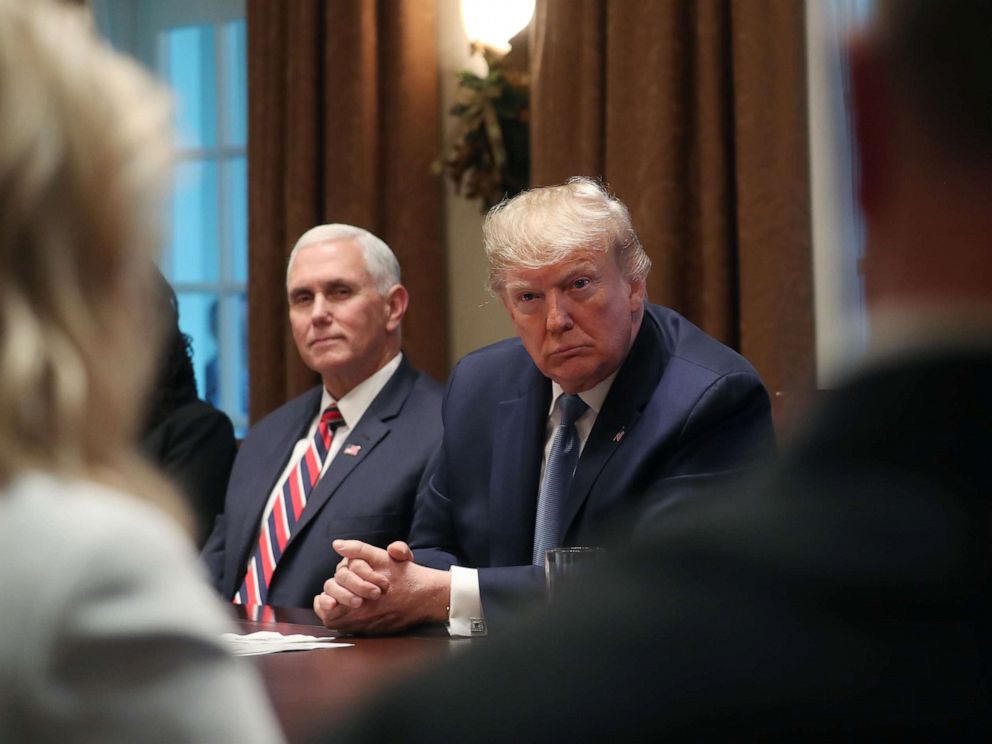 PHOTO: President Donald Trump and Vice President Mike Pence, left, listen during a round table on empowering families with education choice, in the Cabinet Room on Dec. 9, 2019, in Washington, D.C. 