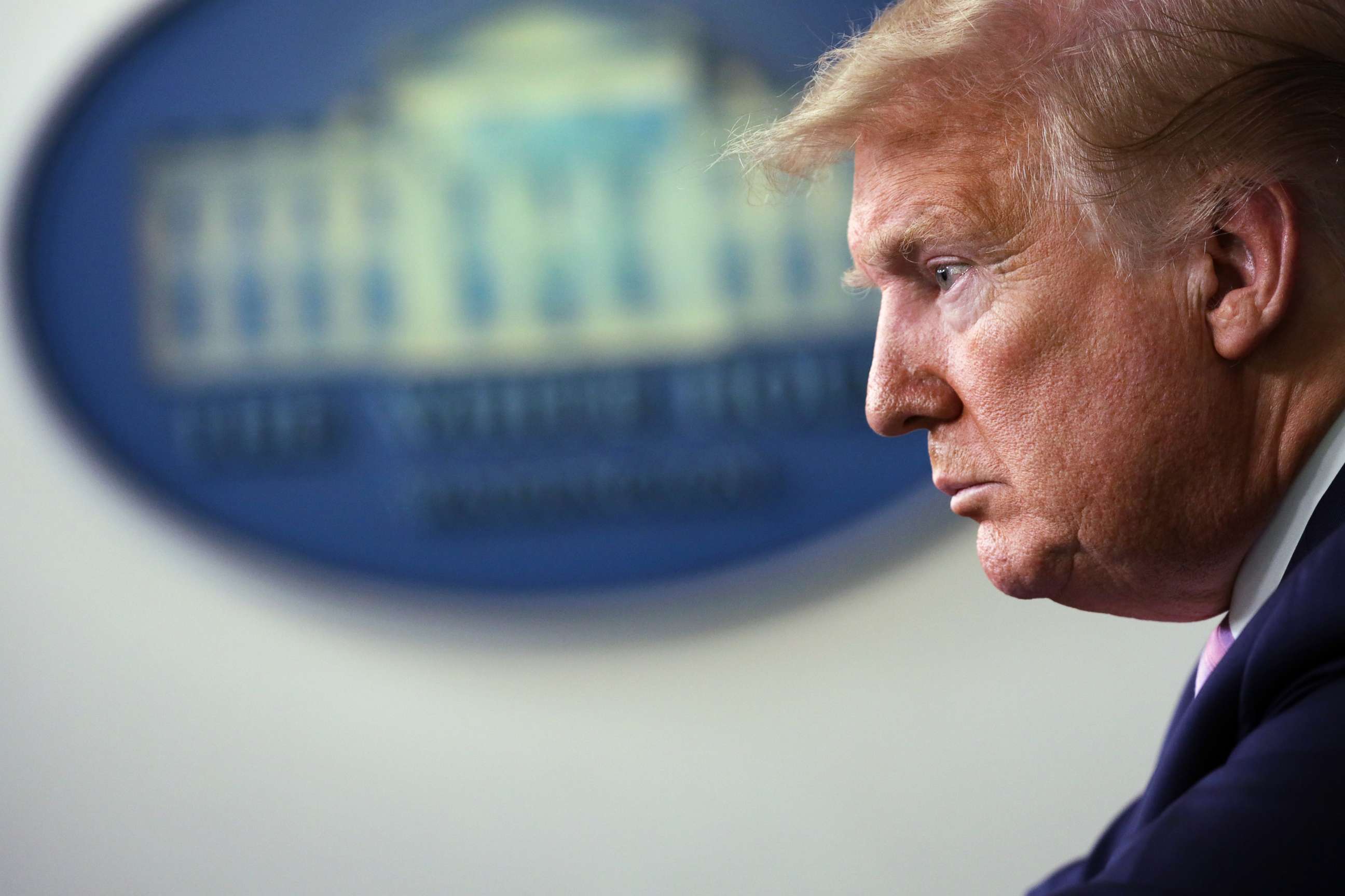 PHOTO: President Donald Trump listens during the daily briefing of the White House Coronavirus Task Force, April 10, 2020, at the White House in Washington.