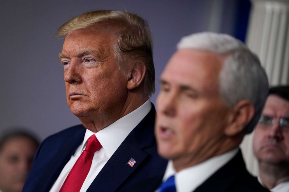 PHOTO: President Donald Trump listens as Vice President Mike Pence speaks during press briefing with the Coronavirus Task Force, at the White House, March 18, 2020, in Washington.