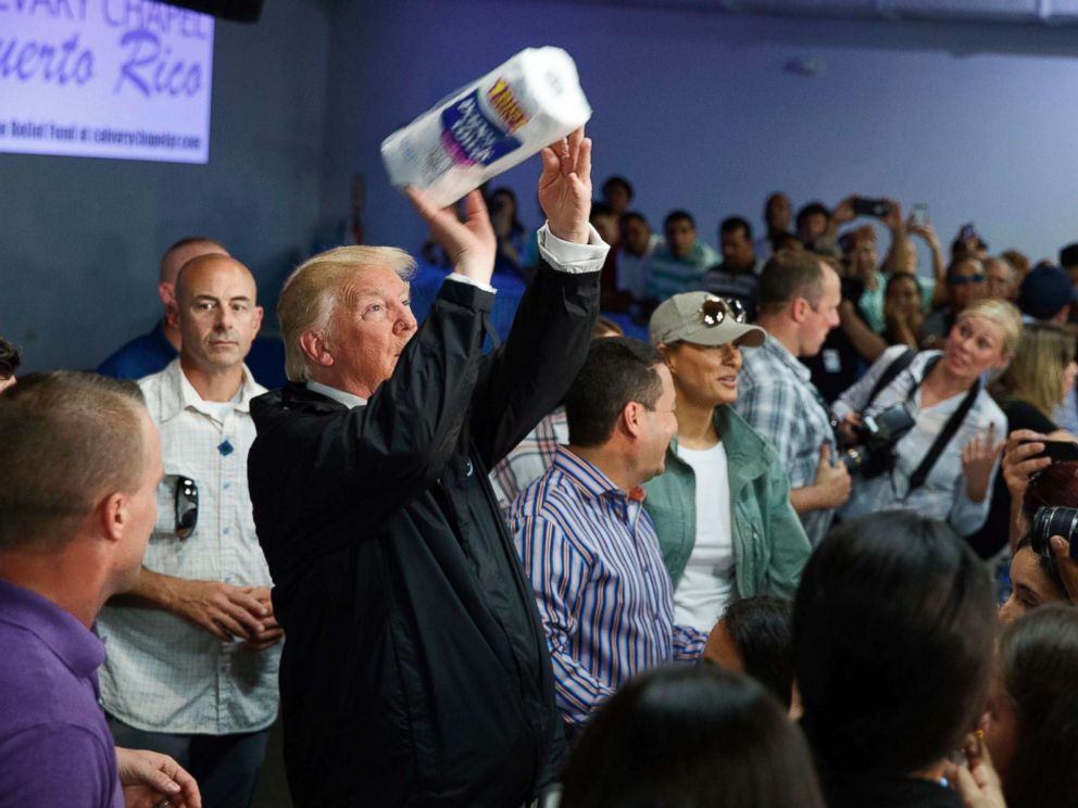 PHOTO: President Donald Trump tosses paper towels into a crowd as he hands out supplies at Calvary Chapel, Oct. 3, 2017, in Guaynabo, Puerto Rico.
