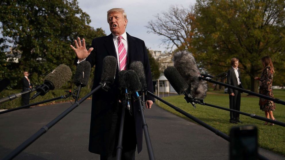 President Donald Trump talks to reporters as he departs the White House Nov. 21, 2017 in Washington.
