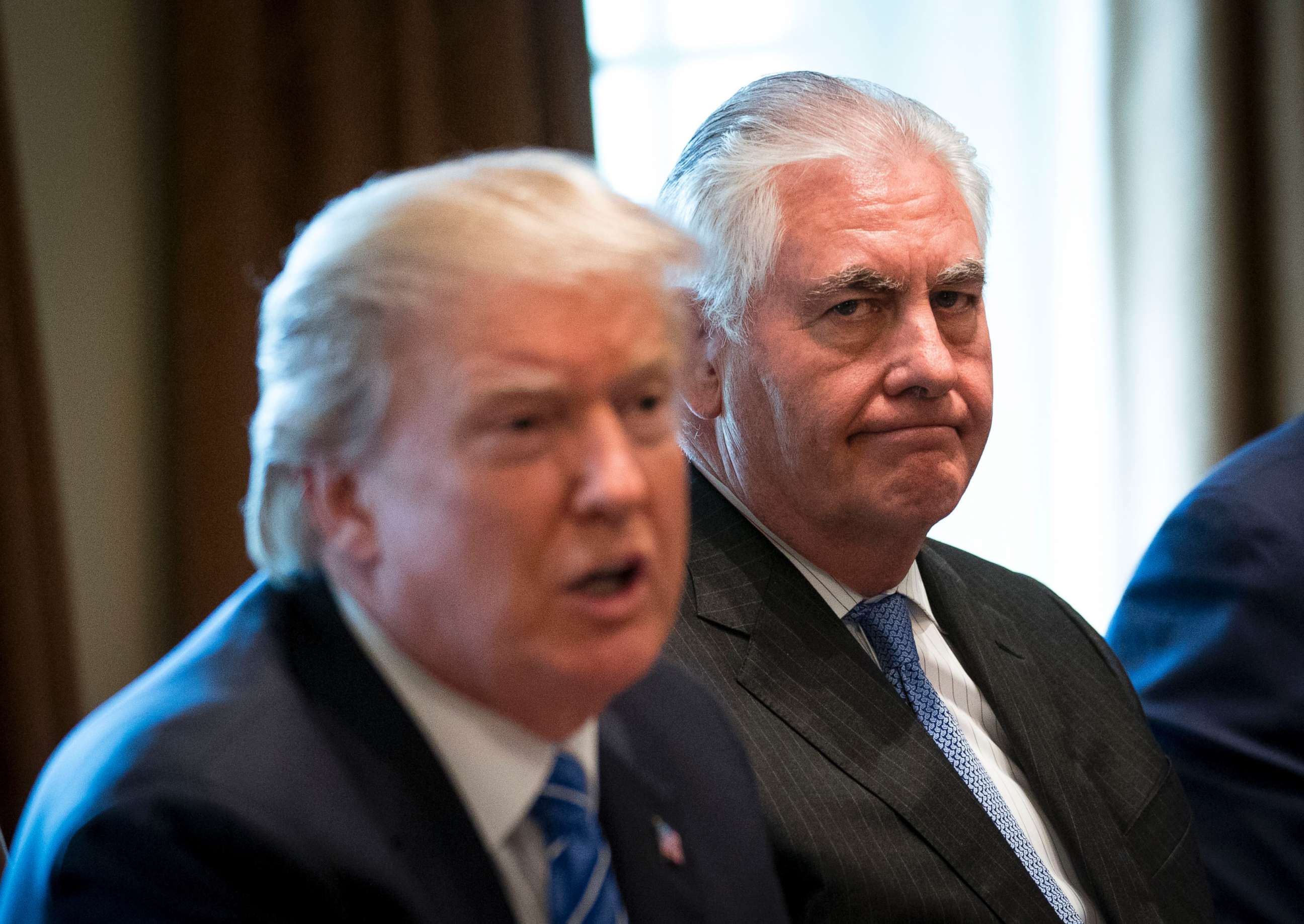 PHOTO: Secretary of State Rex Tillerson listens as President Donald Trump speaks during a meeting in the Cabinet Room of the White House in Washington, Sept. 12, 2017.