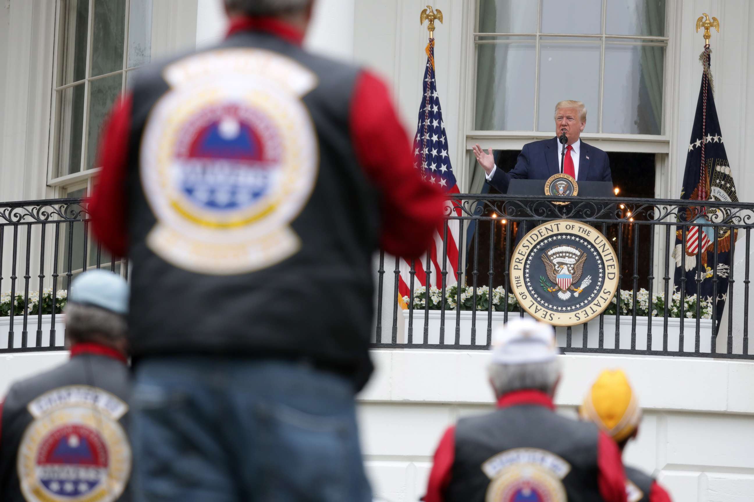 PHOTO: President Donald Trump speaks from the Truman Balcony during a ceremony to honor veterans at the White House May 22, 2020, in Washington.