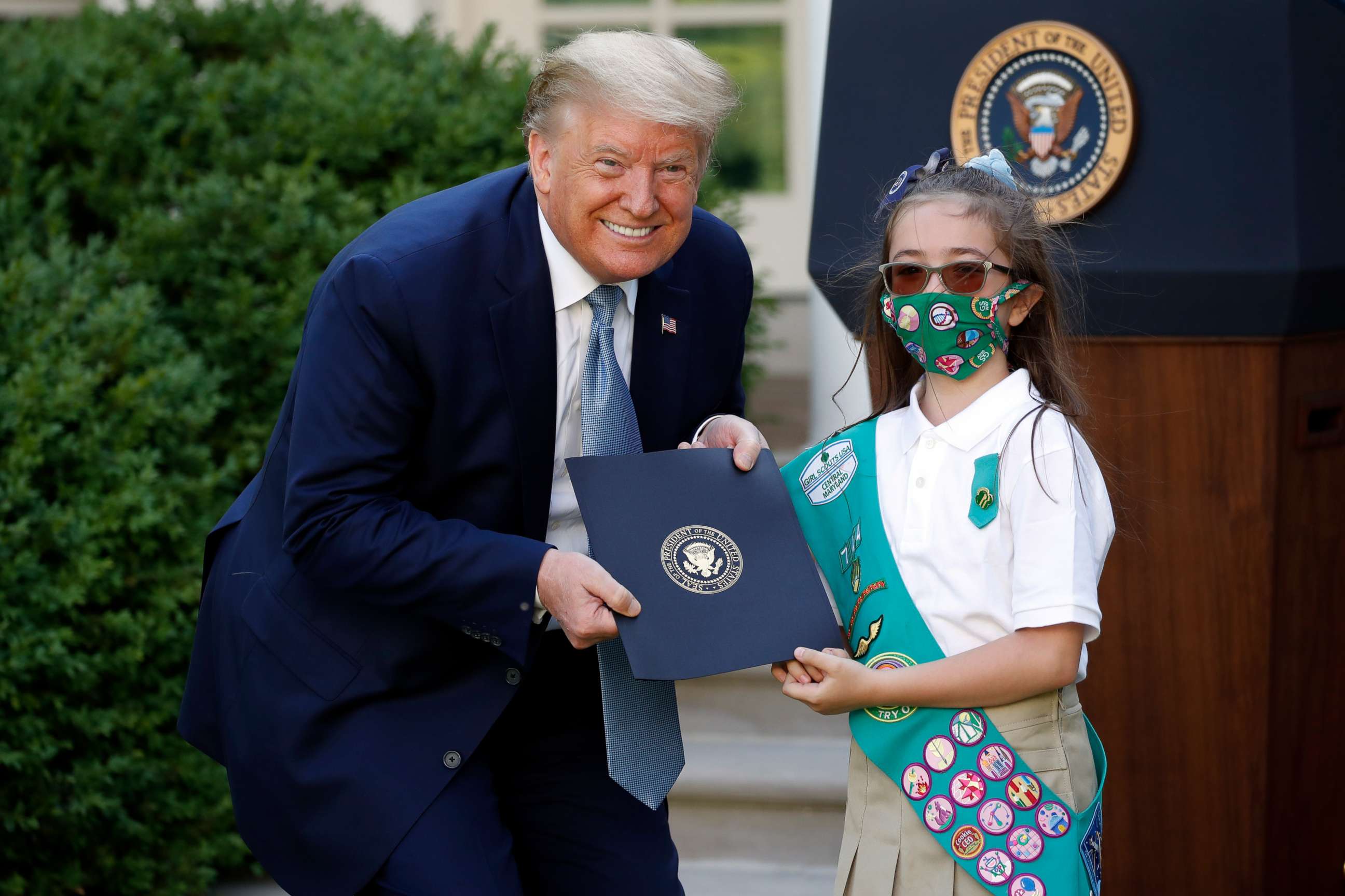 PHOTO: President Donald Trump poses for a photo with Girl Scout Troop 744 member Lauren Matney during a presidential recognition ceremony in the Rose Garden of the White House, May 15, 2020, in Washington.