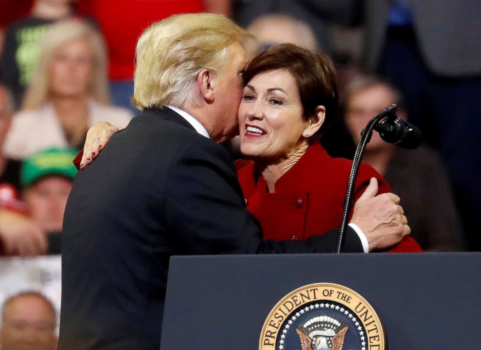 PHOTO: President Donald Trump embraces Iowa Governor Kim Reynolds as he holds a campaign rally in Council Bluffs, Iowa, Oct. 9, 2018.