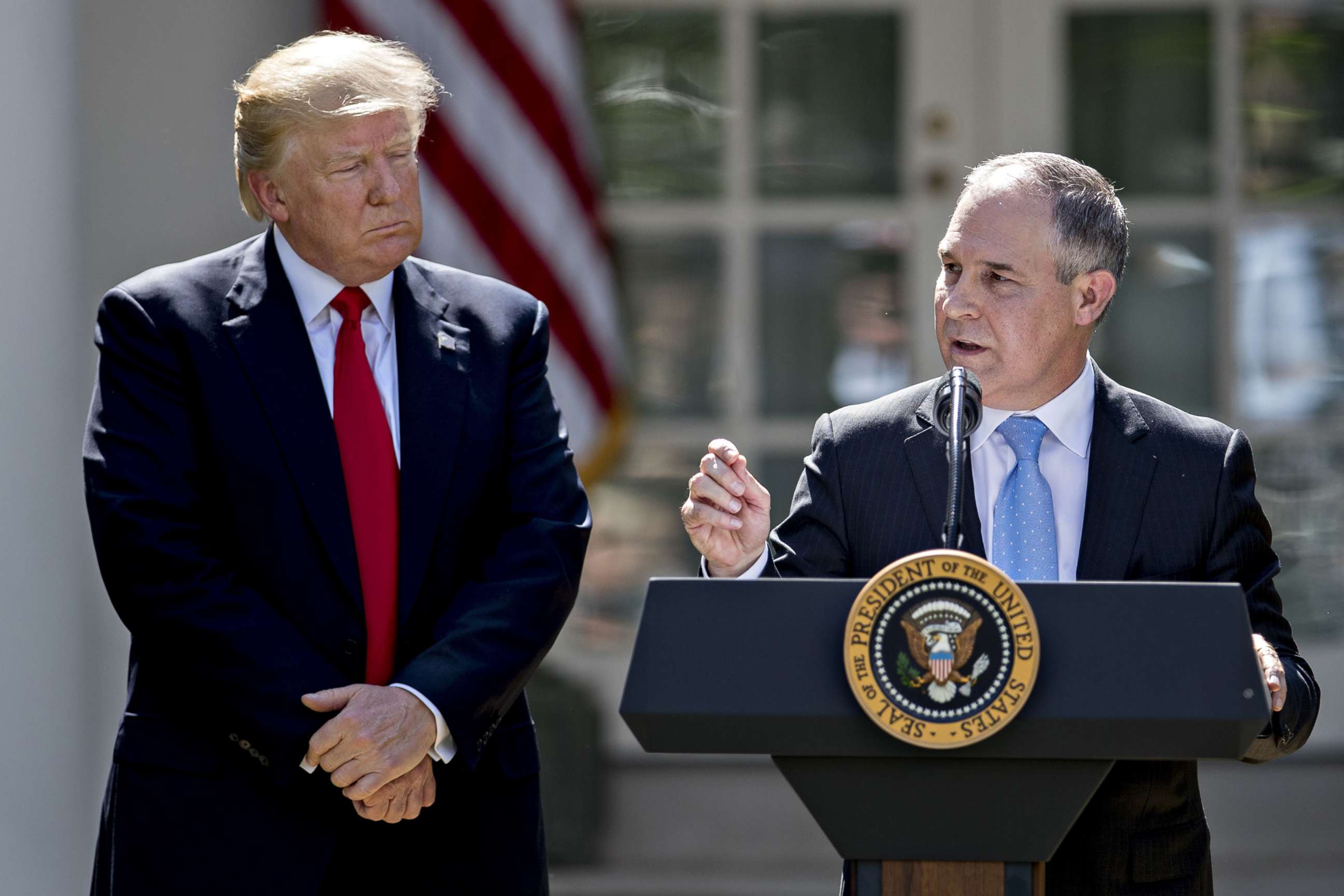 PHOTO: Scott Pruitt, administrator of the Environmental Protection Agency (EPA), speaks as President Donald Trump, left, listens during an announcement in the Rose Garden of the White House in Washington, D.C., June 1, 2017.