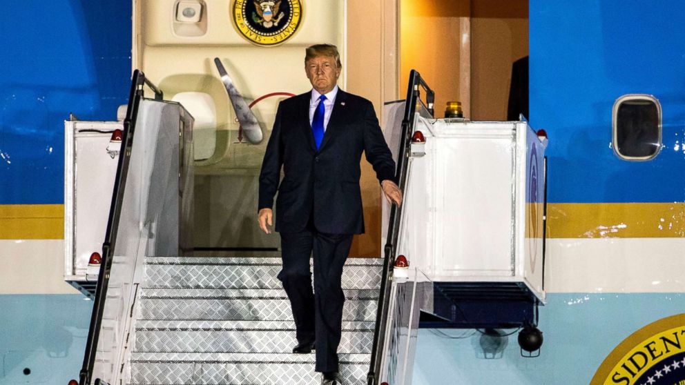 PHOTO: President Donald Trump walks off Air Force One as he arrives at the Paya Lebar Air Base in Singapore, June 10, 2018.